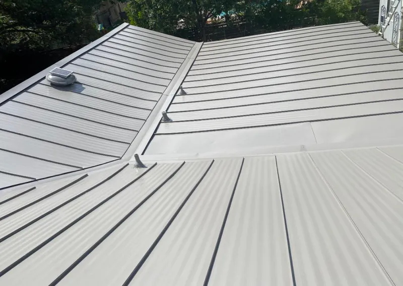 Solar attic fan installed on a metal roof for Roof Ventilation in Hazel Crest